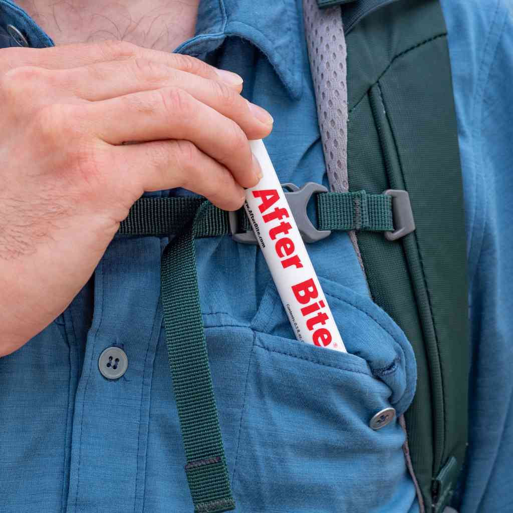 After Bite Advanced man pulling out of blue shirt pocket