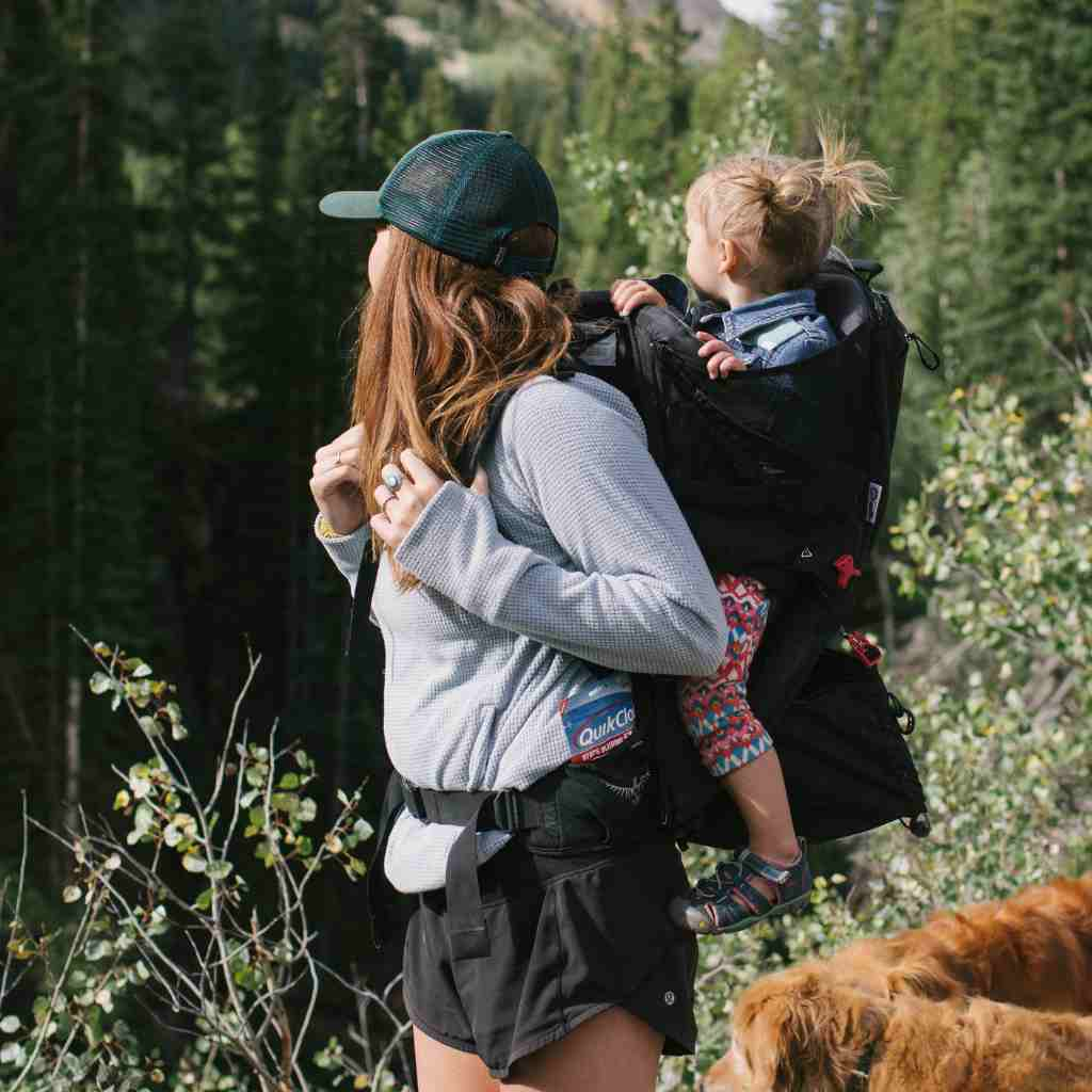 QuikClot Gauze 4 Foot in backpack pocket of woman's bag while carrying child